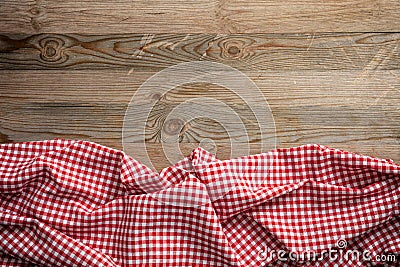 Red white checkered picnic tablecloth on wooden background, copy space Stock Photo