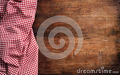 Red white checkered picnic tablecloth on wooden background, copy space Stock Photo