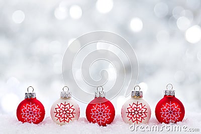 Red and white Christmas ornaments with twinkling silver background Stock Photo