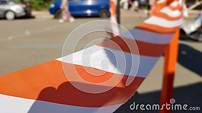 Red white does not cross the tape and the metal pole. Signal red and white tape hanging on a metal fence, danger, warning. Ribbon Stock Photo