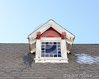 Red and white dormer on historic building Stock Photo