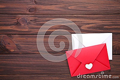 Red and white envelopes on brown background Stock Photo