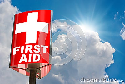 Red and White First Aid Sign on Blue sky with Clouds and Sunbeams Stock Photo