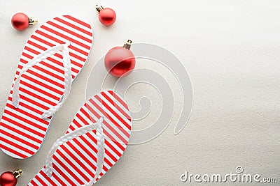 Red and white flip flops and Christmas ornaments Stock Photo