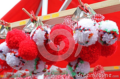 Red and white martenitsi on outdoor market for martenici on the street. Martenitsa or martenitza is given on 1st March as a symbol Editorial Stock Photo