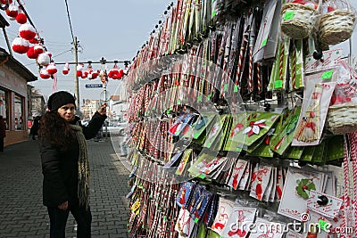 Red and white martenitsi on outdoor market for martenici on the street in Sofia, Bulgaria on Feb 8, 2016. Editorial Stock Photo