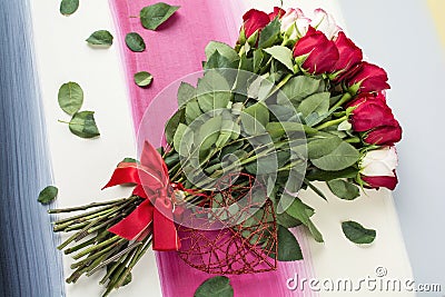 Red and white roses lay flat on painted wood background Stock Photo