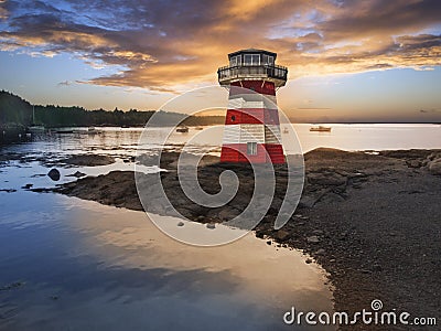 Red and white striped lighthouse Stock Photo