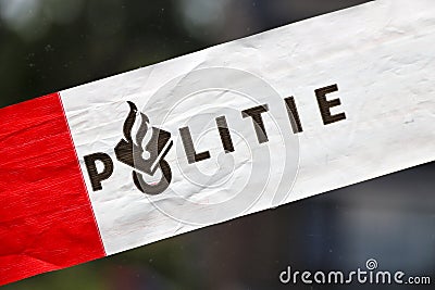 Red and white tape of Dutch police (politie) at incident Editorial Stock Photo