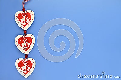 Red and white wooden hearts on a blue-blue background Stock Photo