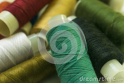 Bobbin of colored threads Stock Photo