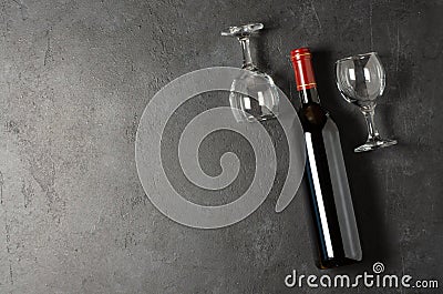 Red wine in a bottle. Black concrete background. Flat lay. Copy space Stock Photo