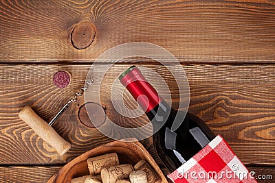 Red wine bottle, bowl with corks and corkscrew. View from above Stock Photo