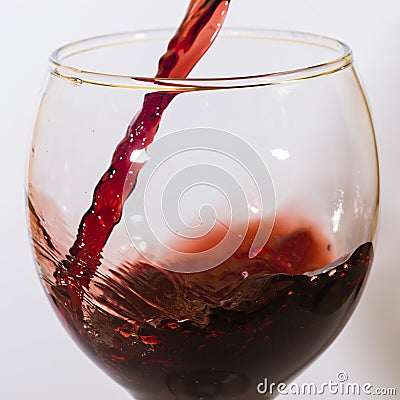 Red wine flow into glass Stock Photo