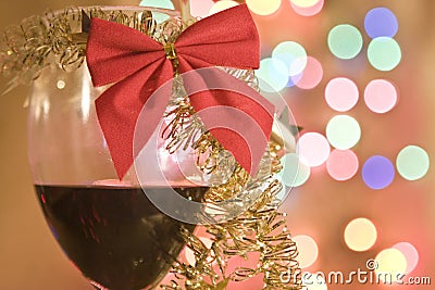 Red wine in glass with christmas tinsel Stock Photo