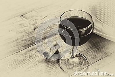 Red wine glasson wooden table. vintage filtered image. black and white style photo Stock Photo