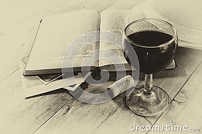 Red wine glasson wooden table. vintage filtered image. black and white style photo Stock Photo