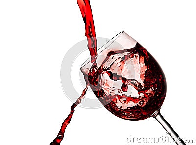 Red wine poured into crystal glass Stock Photo