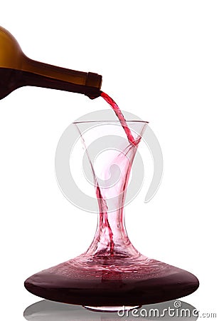 Red wine poured into decanter Stock Photo