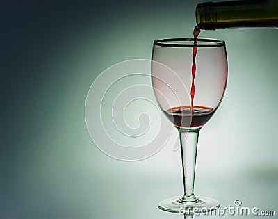 red wine is poured into a glass Stock Photo