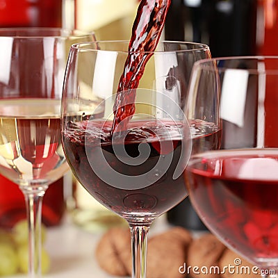 Red wine pouring into a wine glass Stock Photo