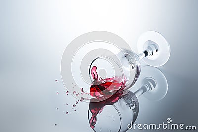 Red wine spilled out of a falling glass Stock Photo