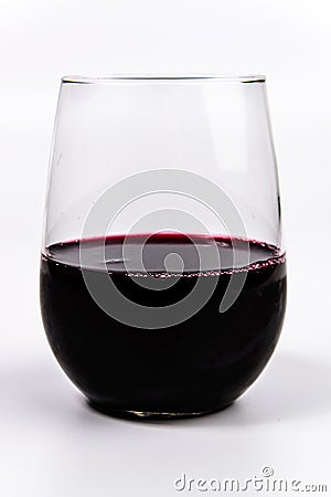 Red Wine in a stemless wine glass Stock Photo