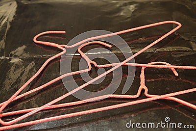 Red wire clothes hangers ready for the new season Stock Photo