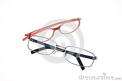 Red woman glasses made of plastic and black man glasses made of metal Stock Photo
