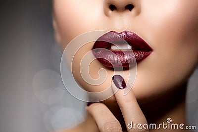 Red woman lips close up. Beautiful model girl with lipstick Stock Photo