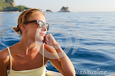 Red woman on a yacht cruise Stock Photo