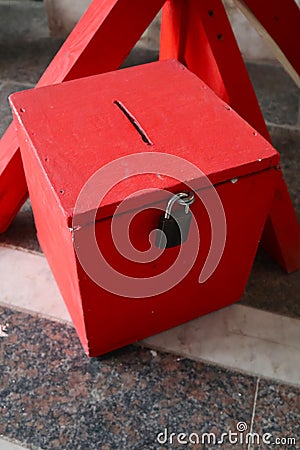 red wooden donation box Stock Photo