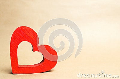 Red wooden heart, isolate, the concept of love, romance, feelings, valentine`s day, organ donors, blood transfusion, charity. pla Stock Photo