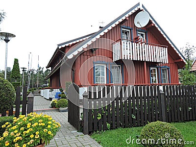 Red wooden home, Lithuania Stock Photo