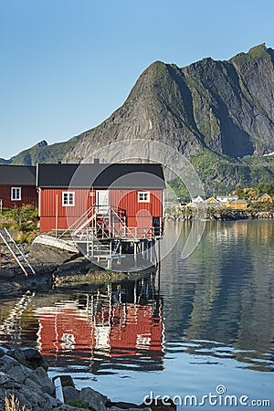Red wooden house called rorbu on Lofoten Islands Stock Photo