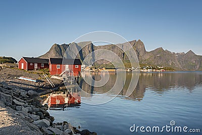 Red wooden house called rorbu on Lofoten Islands Stock Photo