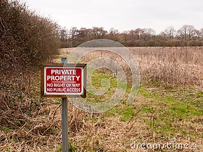 red wooden private property sign farm land no right of way no pu Stock Photo