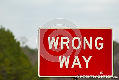 Red Wrong Way Sign on the Road Stock Photo