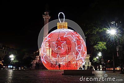 Christmas Lisbon, Lighted Red Ball with White Stars, Xmas Editorial Stock Photo