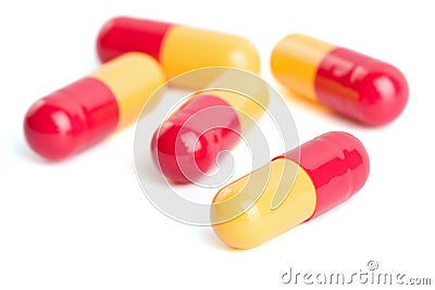 Red and yellow capsule pills isolated Stock Photo