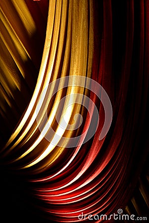 Red & yellow drapes or curtains on a stage Stock Photo