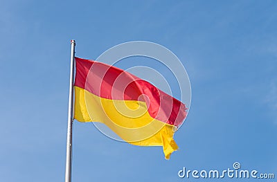 Red with yellow flag Stock Photo