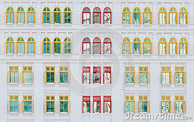 Red and yellow open windows on classical building Stock Photo