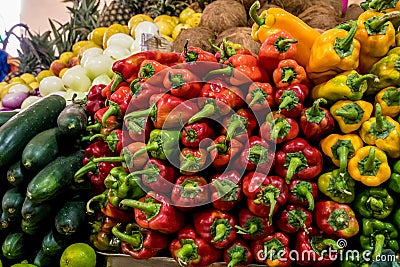 Pile of red and yellow peppers at the vegetables market. Stock Photo