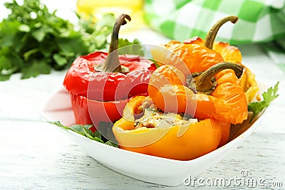 Red and yellow peppers stuffed with the meat, rice and vegetables Stock Photo