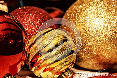 Red and yellow shimmering christmas baubles, retro photo filter Stock Photo