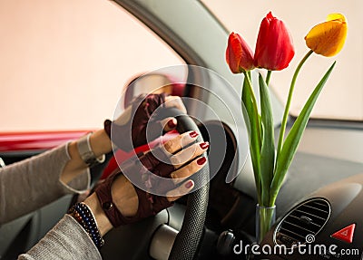 Red and yellow tulips bring joy women when driving Stock Photo