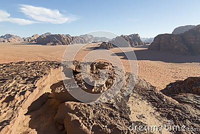 Reddish sand and rock landscapes in the desert of Wadi Rum Stock Photo