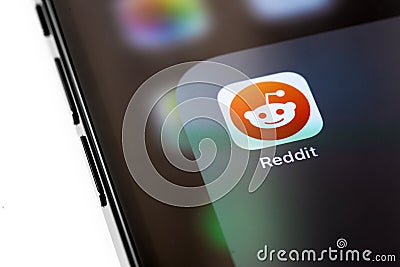 Reddit mobile app icon on the screen Editorial Stock Photo