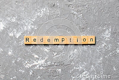Redemption word written on wood block. redemption text on cement table for your desing, concept Stock Photo